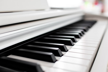 close-up of piano keys. close frontal view, black and white piano keys, viewed from side