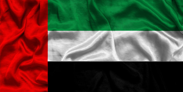 National flag of UAE background with fabric texture. Flag of UAE in correct proportions waving in the wind. 3D illustration
