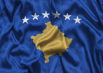 National flag of Kosovo background with fabric texture. Flag of Kosovo in correct proportions waving in the wind. 3D illustration