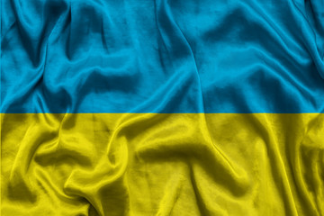 National flag of Ukraine background with fabric texture. Flag of Ukraine in correct proportions waving in the wind. 3D illustration