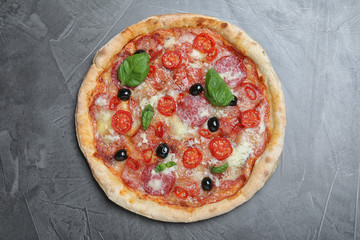 Delicious pizza Diablo on grey table, top view