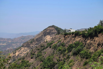 Top view of mountains under clear blue sky in India