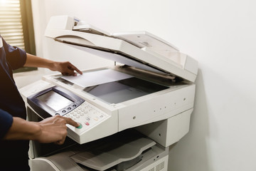 Business people keypad hand on the panel printer, printer, scanner, laser copier, office equipment, concept, start working