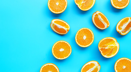 High vitamin C, Juicy and sweet. Fresh orange fruit on blue background.