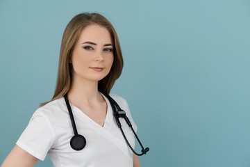 White female doctor looking large at the camera with a stethoscope on his neck on a blue background