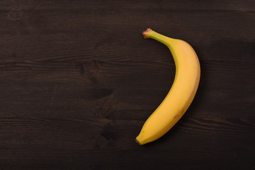 Banana on black woodwn background