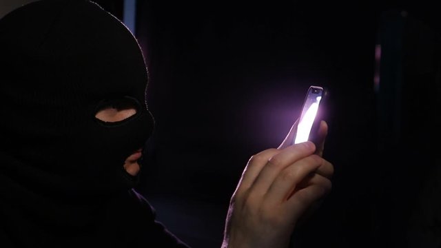 Scammers talking on a smartphone. Criminals use the Internet