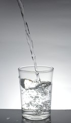 The water that is poured into the glass until almost full