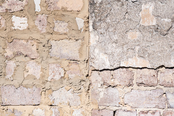 Texture of the old wall of an old gray house. Texture with cracks in the wall.