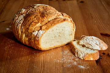 Bread of clowns cut on wooden table and two slices
