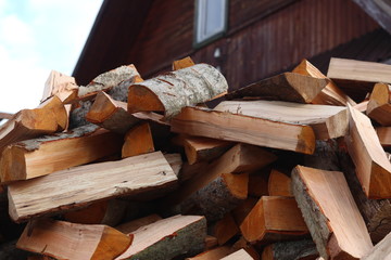firewood for the fire, background. Dry chopped firewood logs ready for winter