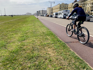 Woman cycling on a bike path