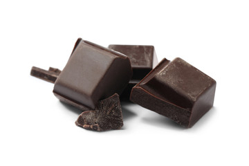 Pieces of delicious dark chocolate isolated on white