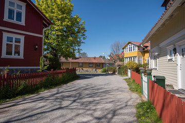 Old wood houses in the town Vaxholm in the Stockholm archipelago a sunny spring morning.