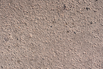 Texture of the old wall of an old gray house. Texture with cracks in the wall.