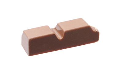 Piece of delicious milk chocolate isolated on white