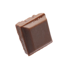 Piece of delicious milk chocolate isolated on white