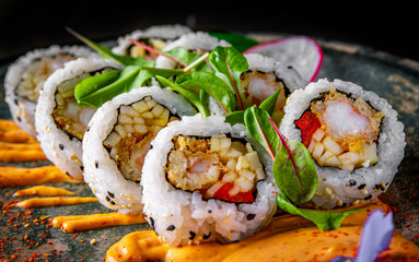 sushi roll in dark plate