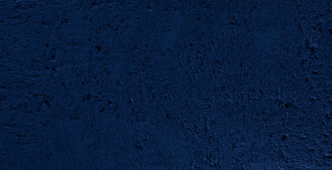 Fototapeta na wymiar Dark blue cement wall as concrete background.