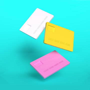 Creative concept of three colorful plastic credit card in white, yellow and pink colors flying in the air. 3D rendering.