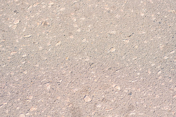 Texture of the old wall of an old gray house. Texture with cracks in the wall.