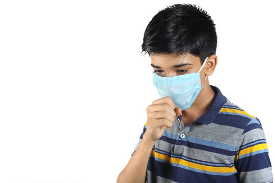 Young boy wearing medical mask angainst coronavirus