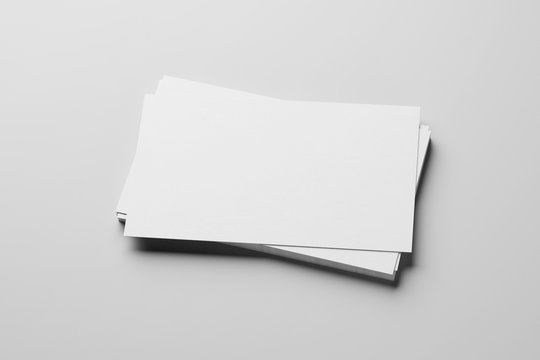 Mockup of business cards stack at white paper background