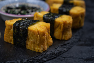 Close up tamago rolls wrappend in sea weed