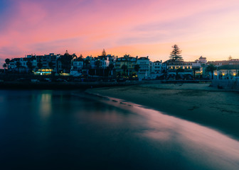 Magenta sunset overlooking the bay and historic centre of Cascais, Portugal