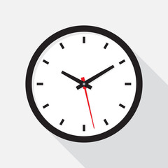 Office clock with shadow on a white background.