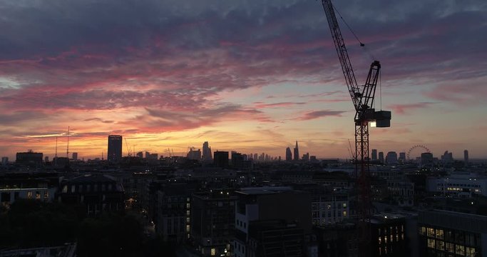 Rising up from street level to reveal London skyline at sunrise