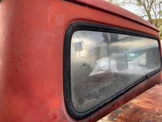 Vintage Red Truck with American Flag Sticker