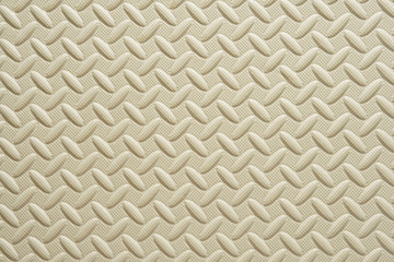 new brown crawling foam pad or cream color rubber floor and beige soft board on top view for baby or children and kid protect to play on playground and for texture or background with wallpaper
