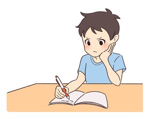 悩みながら勉強する男の子