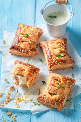 Tasty puff pastry with sausage and herbs