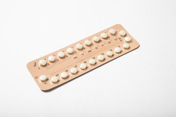 Female oral contraceptive pill blister on a white background background