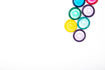 Colored condoms isolated on a white background. Contraception. Place for text