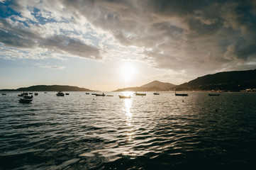View of the lagoon in the Adriatic Sea after rain. Low clouds and small boats in the soft light of the sun