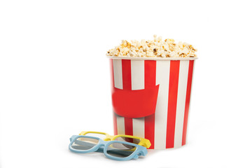 Paper cup with popcorn and 3D glasses isolated on white
