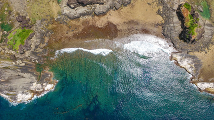 Top view of rock formations and crashing waves in Biri Island, Samar, Philippines. VIsible are...