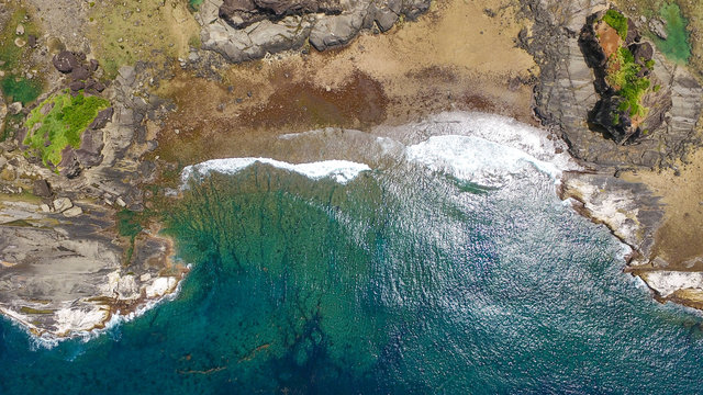 Top view of rock formations and crashing waves in Biri Island, Samar, Philippines. VIsible are Caranas, Bel-at, and Puhunan Rock Formations.