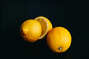 fresh lemon on black background. two lemons.