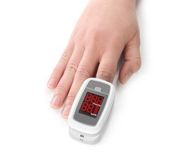 Woman using modern fingertip pulse oximeter on white background, closeup