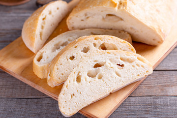 Ciabatta. Fresh italian ciabatta bread on wooden background