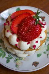 Appetizing cake with strawberry on plate