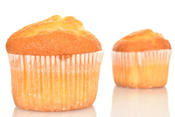 Tasty sweet muffins, close-up, on a white background.
