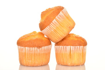 Tasty sweet muffins, close-up, on a white background.