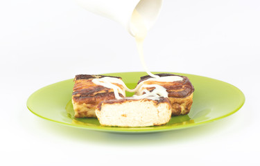Pouring cottage cheese casseroles with condensed milk.