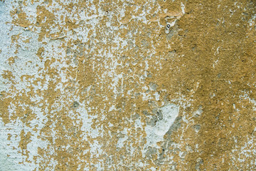 Texture of old peeled wall or ocher concrete fence