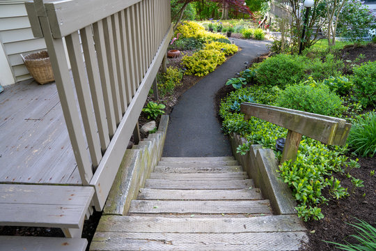 Looking down railroad tie steps to a sidewalk at a condo complex in Spring. Lifestyle concept image